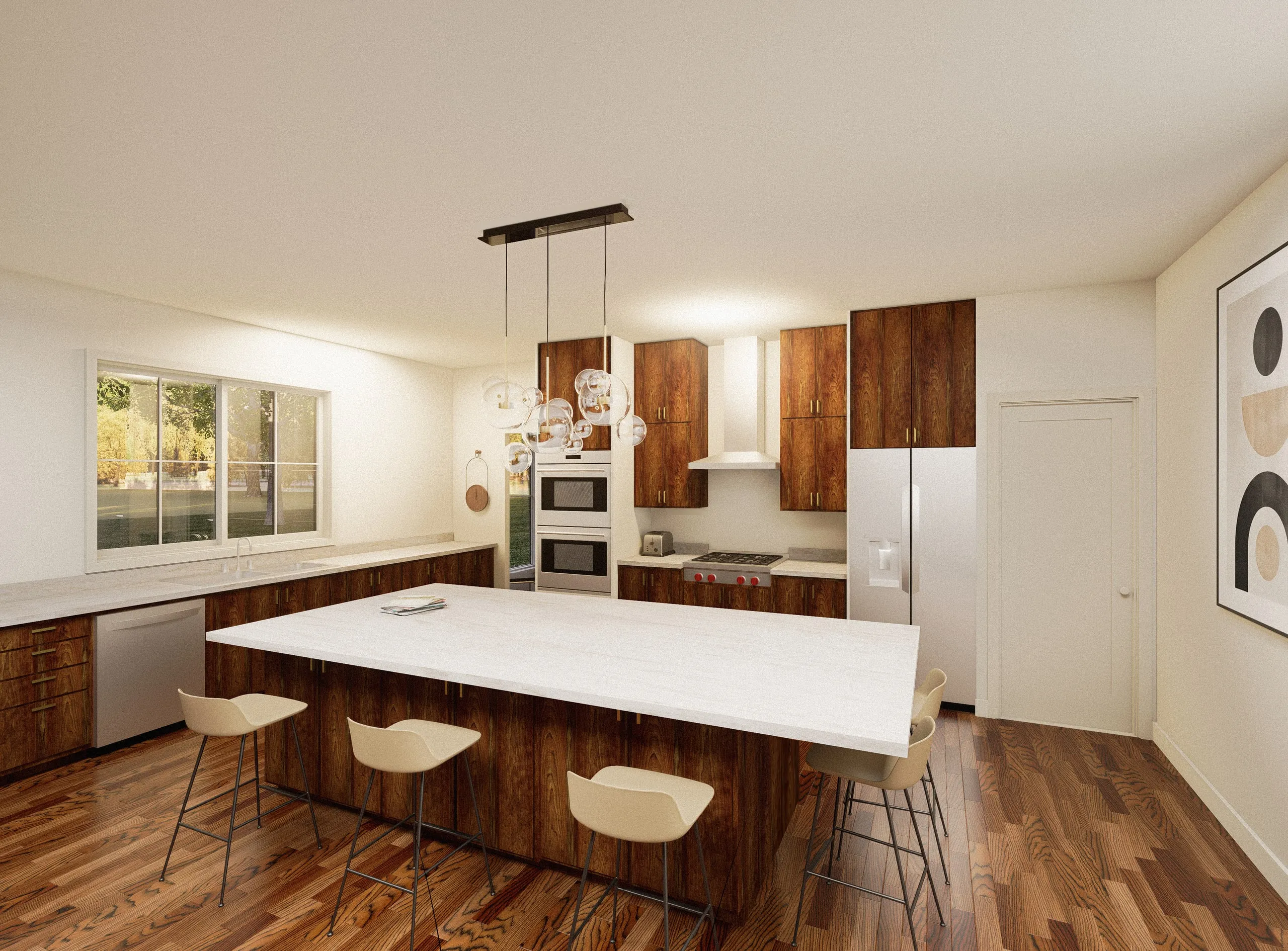 The kitchen — a long perimeter counter under the window, a clear-topped island with stools, walnut cabinetry, a rangetop under its hood and double wall ovens